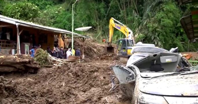 Rescuers dig through mud for survivors after landslides, floods kill 15 in Indonesia