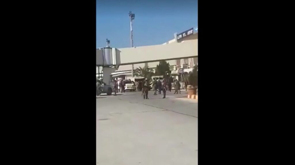 Armed men seen at Aleppo airport after rebels take control of the city