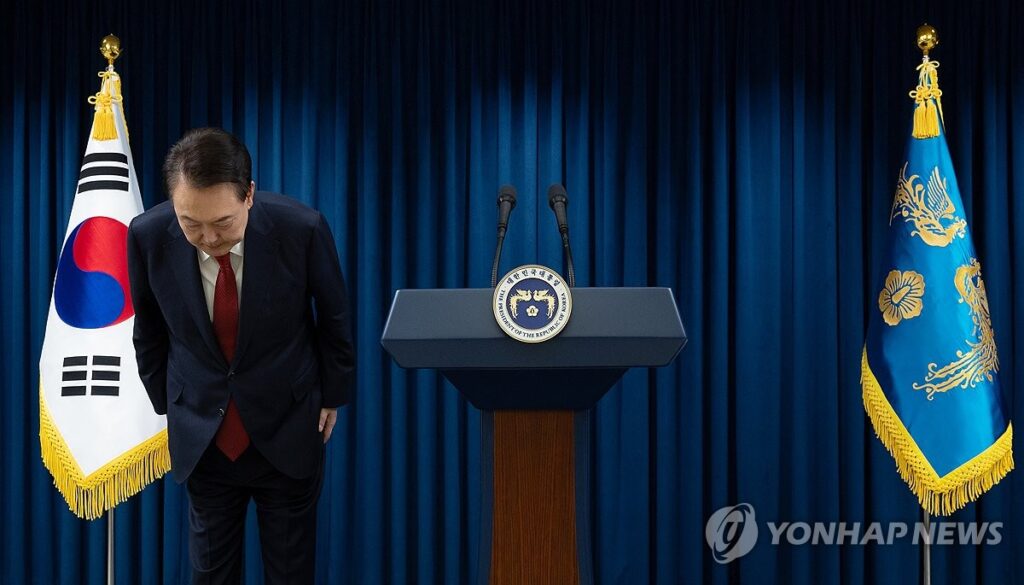 President Yoon Suk Yeol bows his head ahead of a public address at the presidential office in Seoul
