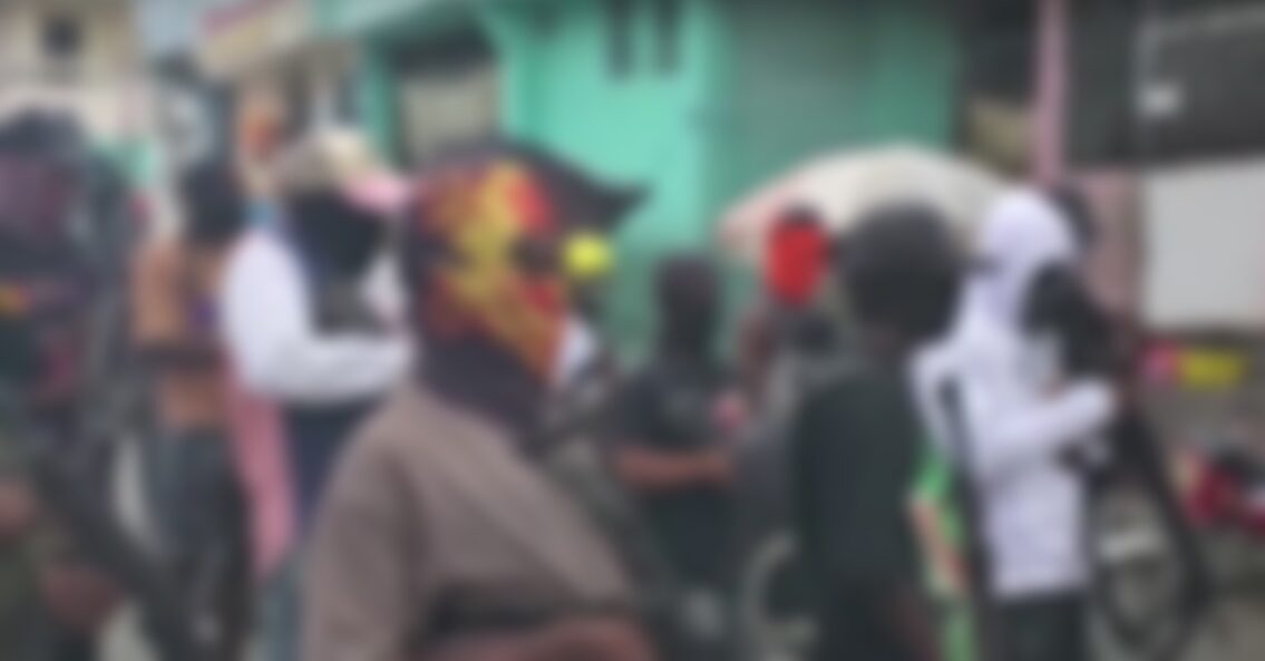 Haiti gang members with guns blur