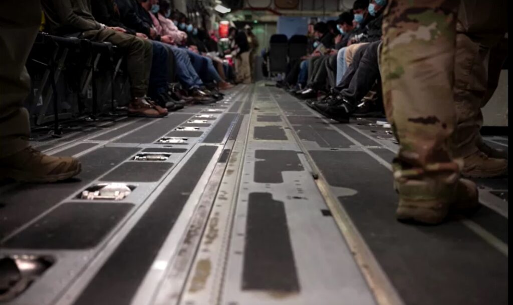 Undocumented migrants boarded onto U.S. military planes for deportation flights