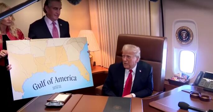 Trump talks with reporters on Air Force One Feb 9, 2025 with map of Gulf of America