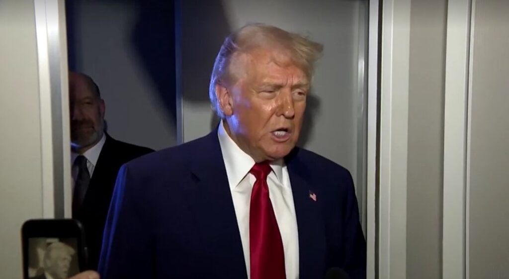 Trump speaks with reporter on plane