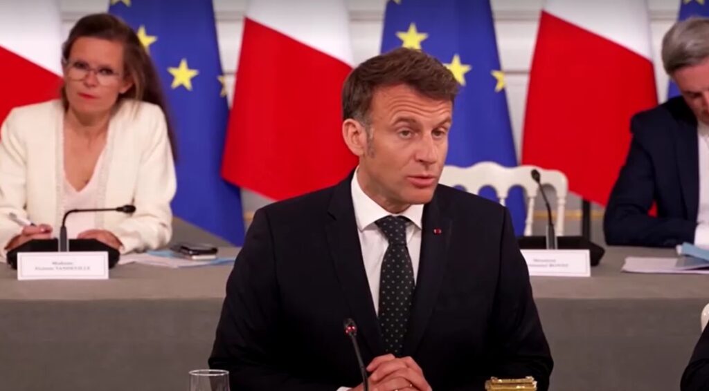 France President Emanuel Macron sitting