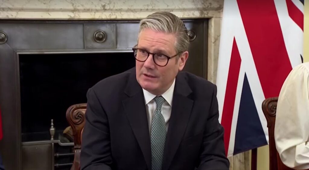 British PM Keir Starmer sitting