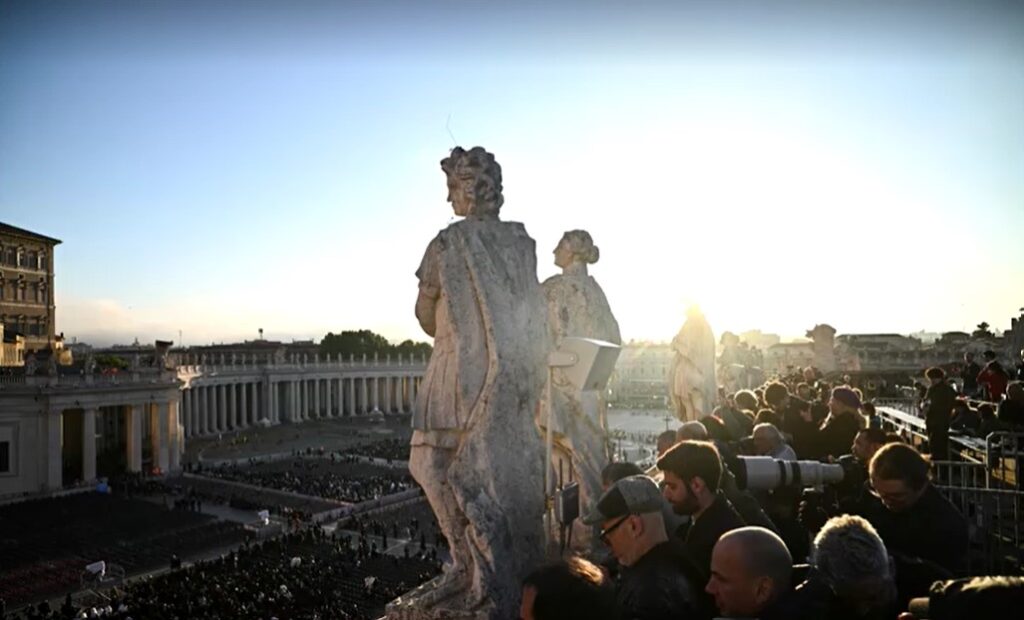 crowds queuing to enter St Peter's Square for papal funeral