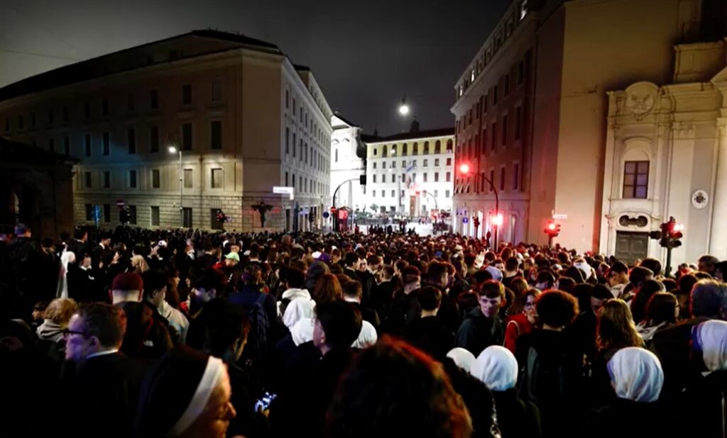 crowds queuing to enter St Peter's Square for papal funeral