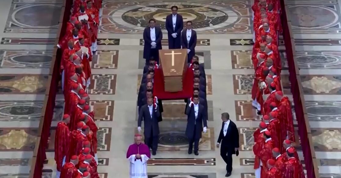 Pope Francis' coffin being carried towards door in St. Peter's Basilica