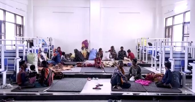 Fearful Indian villagers find refuge in shelter after evacuation