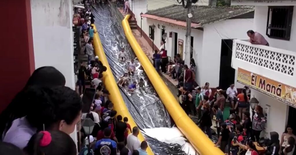Colombian small village turns main street into giant slide