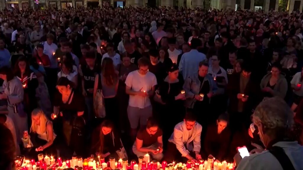 Graz residents light candles and seek comfort after school shooting