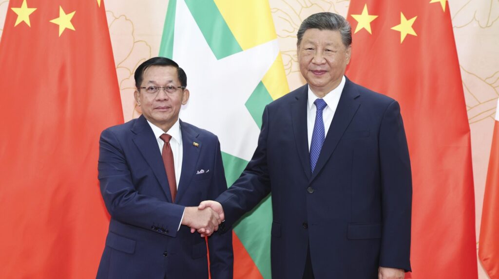 Myanmar Leader Min Aung Hlaing shakes hand with China President Xi Jinping