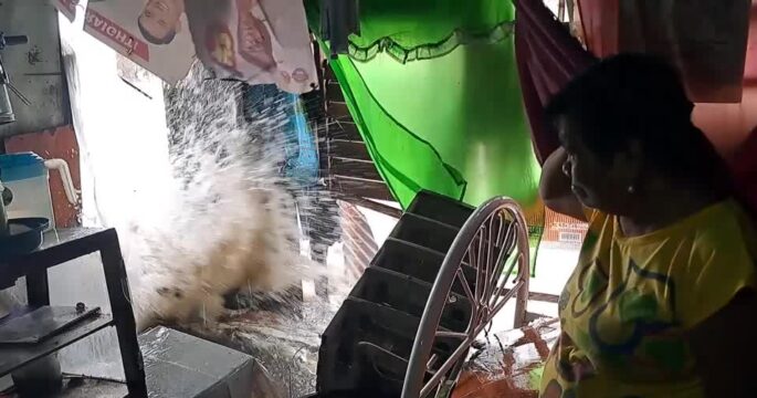 Towns flooded as tropical storm batters the Philippines